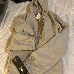 Brand new New Balance women’s rain jacket.